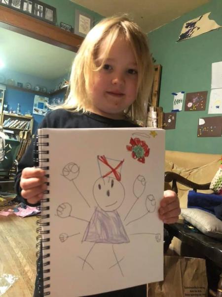 Raynard Roth, age 5 and a half, drew a picture of his mom fighting the COVID-19 virus. His mom, Margaret Roth, is a nurse at Good Samaritan Hospital in Downers Grove, Ill, in the Chicago suburbs, where she works at a COVID vaccine clinic administering the shots. Photo by Margaret Roth