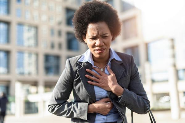 Woman experiencing chest pains