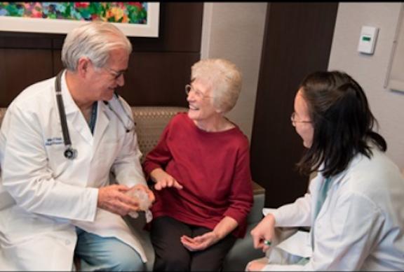 Patient Lillian Keavey speaks with Henry Ford cardiologists William O'Neill and Dee Dee Wang about her case. She was the 1,000th patients at Henry Ford to have their procedure guided by 3-D print.