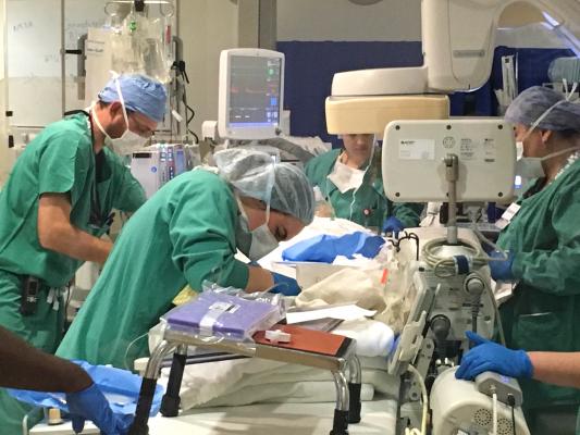 Cath lab techs and nurses working as a team to prepare a hybrid OR at the University of Colorado Hospital for a MitraClip procedure. Recruiting and retaining good cath lab staff, nurses and tech can be a difficult job.