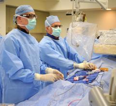 Adam Greenbaum, M.D., and William O'Neill, M.D., perform a TAVR procedure in a hybrid cath lab at Henry Ford Hospital in Detroit. Structural heart