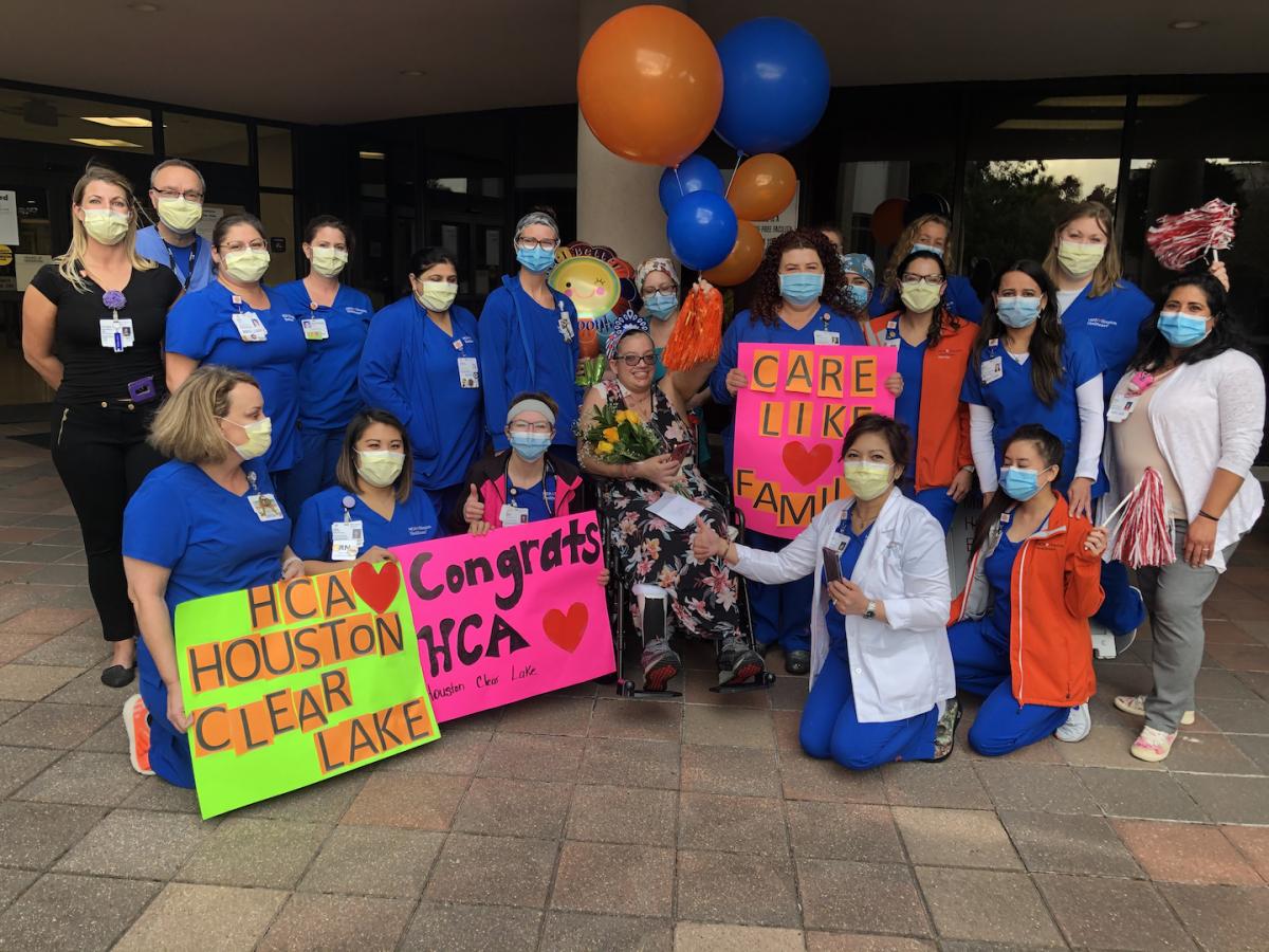 Staff that helped support and save COVID-19 patient Crystal Gutierrez during a reunion at HCA Houston Healthcare Medical Center and Houston Heart.