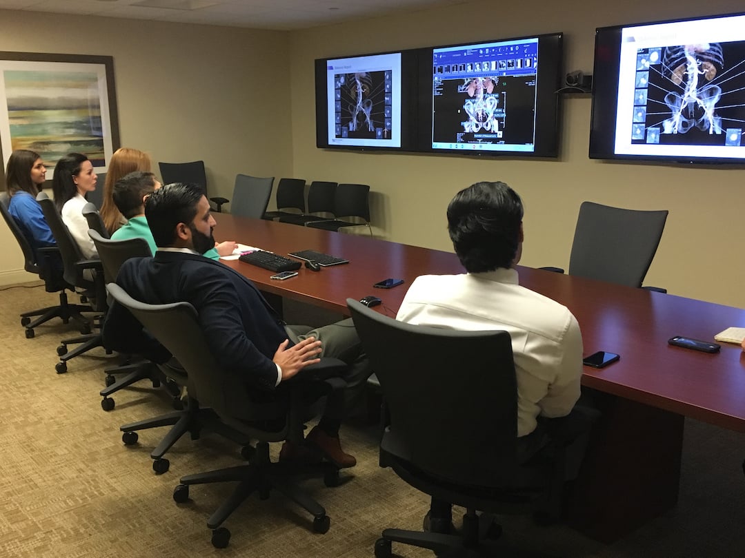 The heart team at Northwestern Medicine's Central DuPage Hospital in Winfield, IL, assessing a TAVR patient case to plan the procedure. The cardiac surgeon and the interventional cardiologist discussed issues with femoral access and discussed the possible need for a transapical approach if the femoral route proved too difficult to navigate the larger TAVR catheters. Photo by Dave Fornell