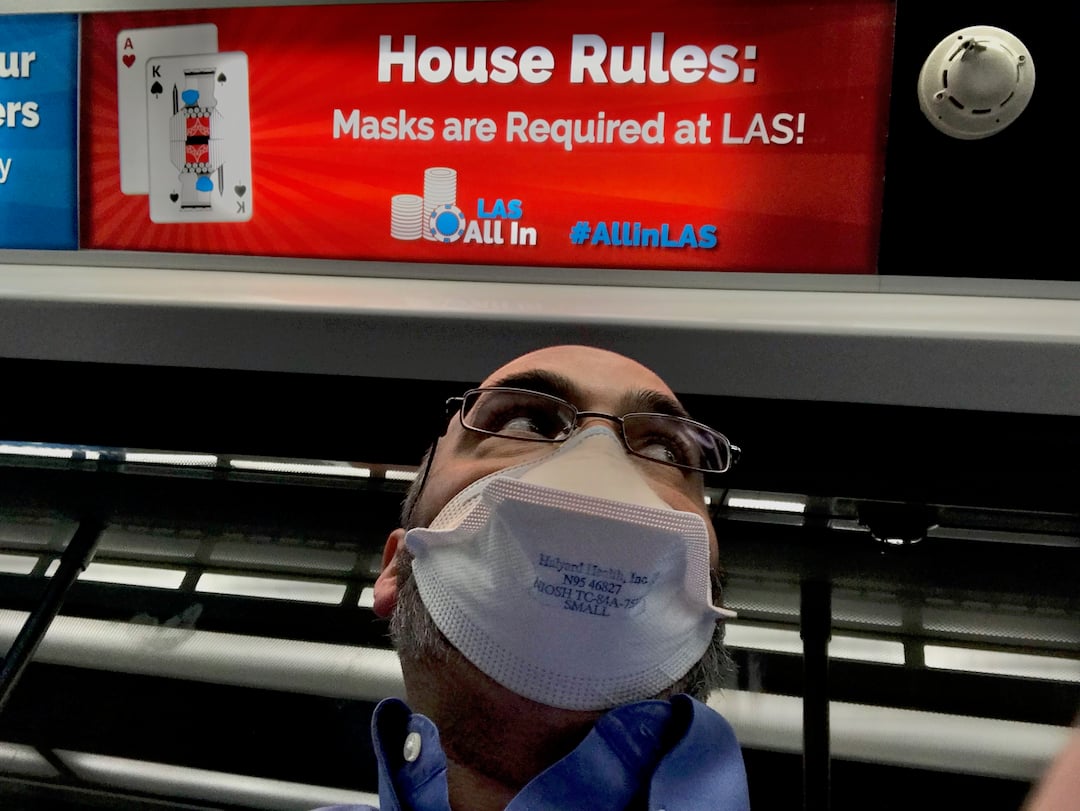 A spike in COVID cases in Las Vegas led the city to require masks for all businesses, and it was quickly followed by a state mandate requiring masks for everyone, regardless of vaccination status, indoors. Masking signs on the Las Vegas airport terminal train. Signs promoting masking, vaccinations and COVID testing were everywhere at the airport to greet visitors attending HIMSS.. 