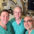 John Messenger, M.D., and Kevin Rogers, M.D., with DAIC Editor Dave Fornell in their cath lab at the University of Colorado.