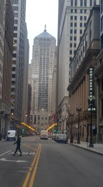 The heart of normally bustling downtown Chicago showing deserted streets at rush hour Tuesday, March 24. The view is down LaSalle Street with the Chicago Board of Trade building at the end of the street. Photo by Mike Augle. #coronavirus #COVID19