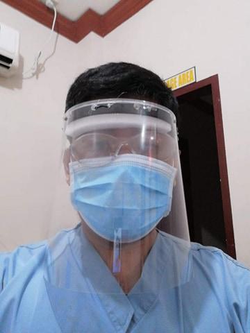 A radiology technologist Dodge Moises made his own personal protective equipment (PPE) face shield due to a severe shortage of PPE at Sen. Gerardo M. Roxas Memorial District Hospital in Iloilo City, Philippine. He used X-ray film that had gone bad with the emulsion stripped off, foam packing material, elastic and a glue gun to make own face shields for the techs. They were only issued 2 pairs of PPE for the duration of COVID-19, so they had to supplement. Photo by Dodge Moises.