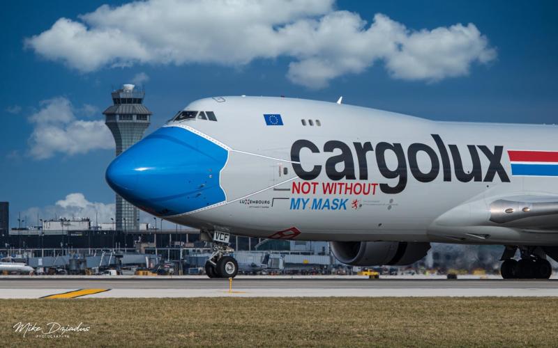 A cargo plane painted to promote mask wearing during the COVID pandemic at O'Hare International Airport in Chicago. Photo by Michael Dziadus