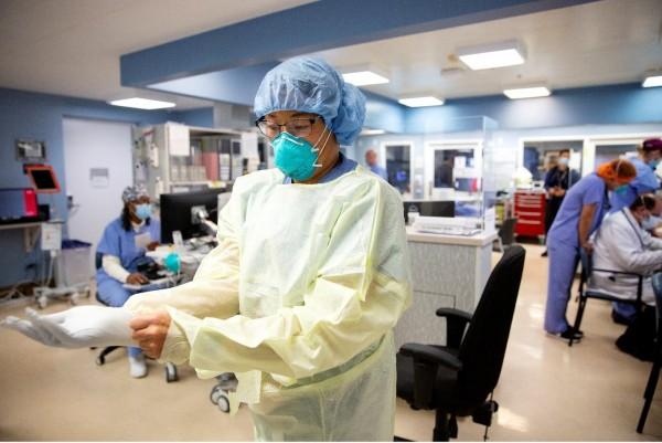 Nurse dons PPE before enter COVID room Cedars Sinai