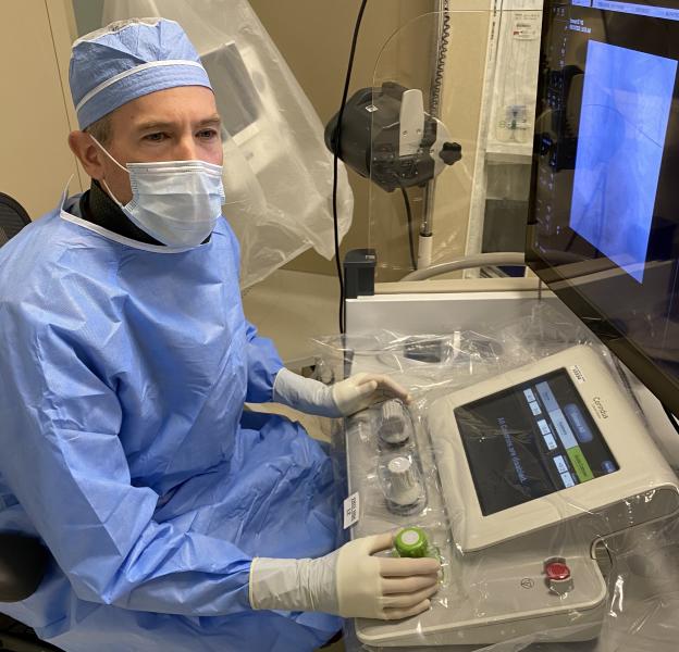 The Corindus CorPath robotic cath lab navigation system allows operators to sit and control the procedure from behind a lead-lined booth, so they do not have to wear heavy aprons during the procedures.  Christoper Baker, M.D., Hoag Memorial Hospital using the system. #SCAI21 #SCAI2021