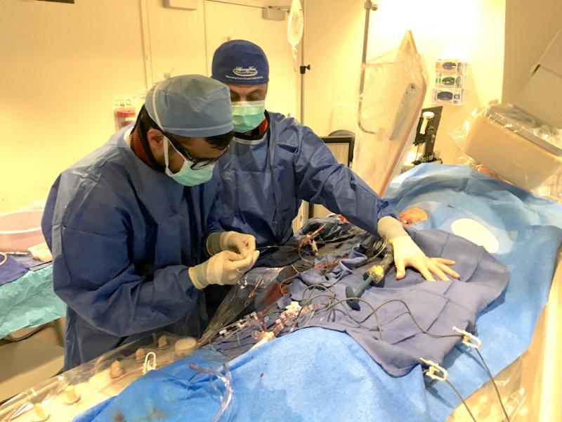Khaldoon Alaswad, M.D., right, director, cardiac catheterization lab, during a complex CTO procedure at Henry Ford Hospital. 