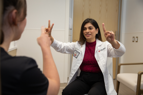 Eva Mistry, MD, right with a patient. Photo/Andrew Higley/UC Marketing + Brand. 