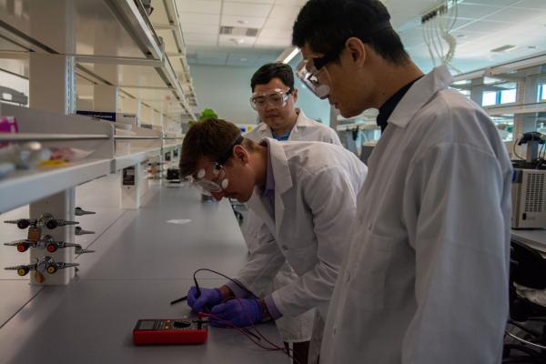 Brian Arends, left, checks the electrical resistivity and conductivity of the wearable heart monitor as Zheng Yan, center, and Yadong Xu, right, observe in Yan's lab. The lab is located in the Roy Blunt NextGen Precision Health building. Pate McCuien/University of Missouri 