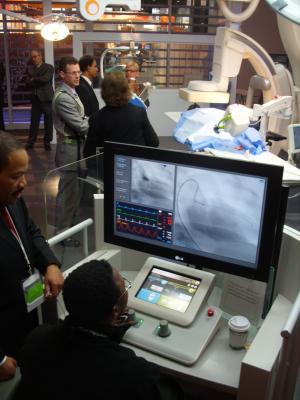 The Corindus CorPath robotic navigation system, which helps guide cath lab procedures without the need for operators to wear lead aprons, was a centerpiece technology in a hybrid OR display created by Philips Healthcare.
