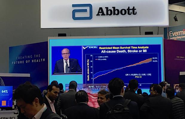 People watch the presentation of the five-year EXCEL Trial data by Gregg Stone, M.D., live in the Abbott booth at TCT 2019. Abbott makes the Xience stent used in the trial, which compared equally with long term surgical outcomes. #TCT2019