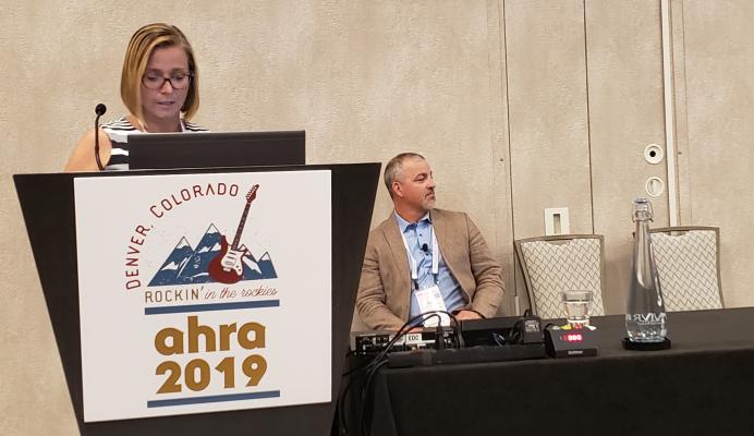 Ali Westervelt presents information at AHRA 2019 supporting the value of FFR-CT as a noninvasive cardiac test for patients at moderate risk of coronary artery disease. Her co-presenter, Curt Bush, looks on. Photo by Greg Freiherr