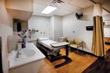 The traditional transfemoral procedure recovery rooms generally appear as stereotypical, sterile, institutional hospital rooms like this one at St. Josephs Hospital of Atlanta. The hospital built a dedicated transradial recovery lounge.