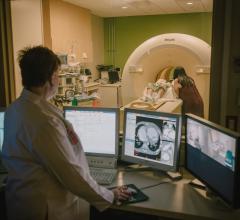 Dianna Bardo, M.D., oversees a pediatric CT scan at Phoenix Children’s Hospital. She uses technology to help lower CT X-ray radiation dose when scanning children. 