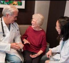 Patient Lillian Keavey speaks with Henry Ford cardiologists William O'Neill and Dee Dee Wang about her case. She was the 1,000th patients at Henry Ford to have their procedure guided by 3-D print.