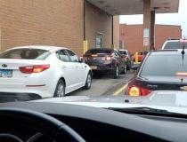 ------ With patients not wanting to stand in line to wait for prescriptions in pharmacies, drive through lines became extremely long across the country, as seen here at a Walgreens in Aurora, Illinois. Photo by David Lasee.