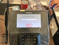 Plastic wrap covering a credit/banking card terminal at a checkout line at a grocery store in the Chicago suburbs. The wrap was added to machines at most stores in an effort to make decontamination of the machines easier. #COVID19