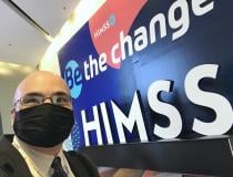 Selfie of DAIC and ITN Editor Dave Fornell in front of the large HIMSS logo outside of the expo hall. Originally HIMSS planned to require all attendees and vendors to be vaccinated so masks would not be required. But with the change in CDC mask guidelines and Nevada creating a mandate to follow those guidelines, masks too were required. Despot precautions, 3 attendees reported testing positive at or after the HIMSS meeting. 