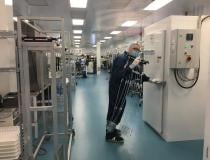 Pulling sterilized Impella catheters out of a sterilizer in the main cleanroom at Abiomed.