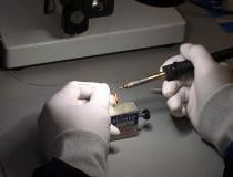 Soldering the Impella impeller motor connections under a microscope.
