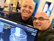 Claudio Smuclovisky, M.D., FACC, FSCCT, director of South Florida Imaging Cardiovascular Institute, Holy Cross Hospital, with DAIC Editor Dave Fornell at SCCT 2019. He spoke on how he uses Twitter to share interesting CT cases with doctors in the U.S. and internationally, who do not have access to a lot of educational seminars. Smuclovisky explains what imaging departments need to know about advances in computed tomography (CT) systems when purchasing the newest generation of CT scanners in the VIDEO: What 