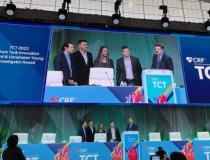 Representatives from Puzzle Medical Devices accept the TCT 2022 Innovation Shark Tank Competition Award from CRF President and CEO Juan F. Granada and Robert Schwartz, MD, President of the Jon DeHaan Foundation for Medical Innovation, which sponsors the award.